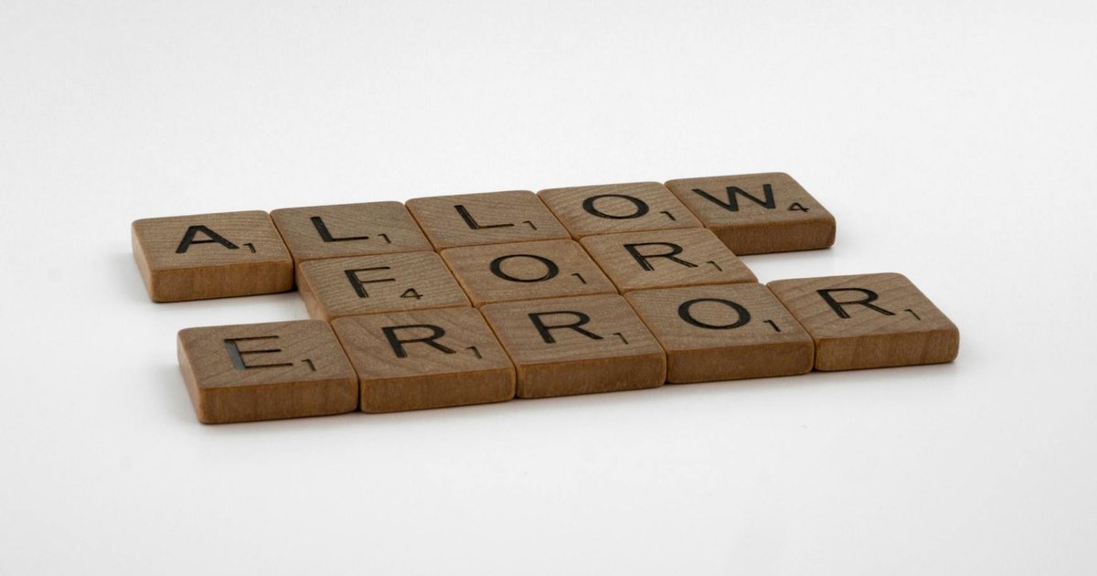 Ilhan Omar speaking at a political event, with a backdrop of Somaliland flags.