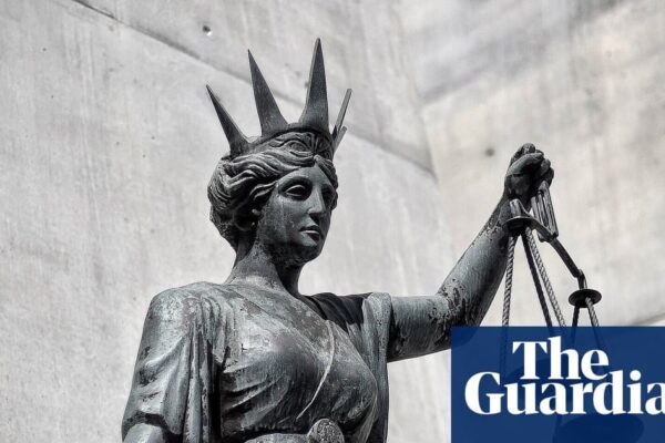 An Aboriginal child standing in a remote Northern Territory landscape, symbolizing cultural connection.