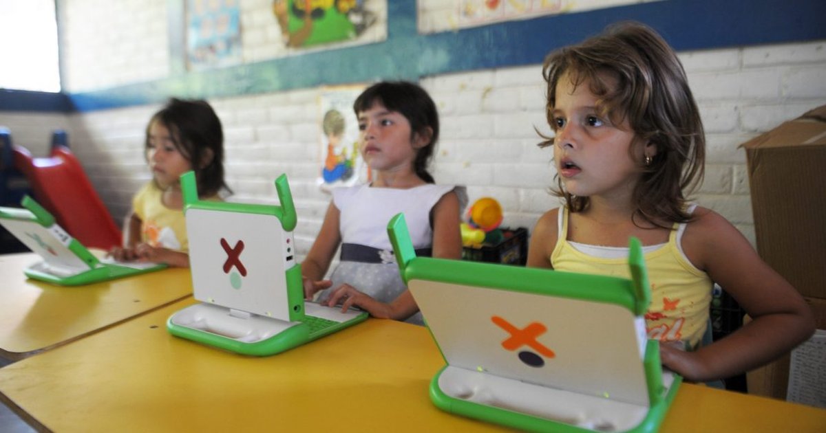 A classroom with students and AI technology, symbolizing the debate over AI in education.