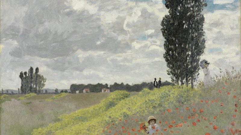 Attendees at an AI technology conference discussing innovations like Claude Design.