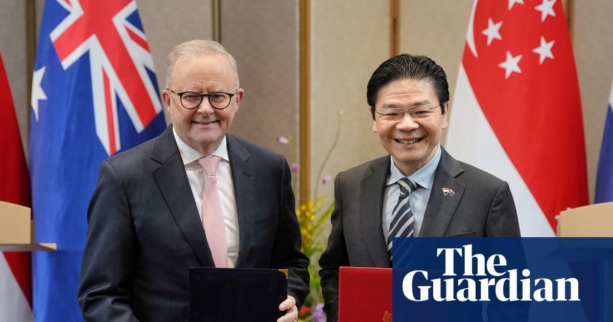 Australian and Singaporean leaders discussing energy security agreement