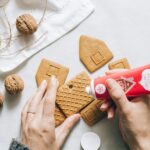 Students baking at Carleton College's renovated Cookie House, a cherished campus tradition.