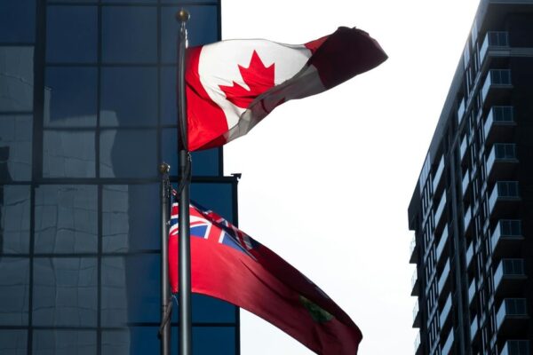 Carolina Hurricanes and Ottawa Senators players battling on the ice during a playoff game.