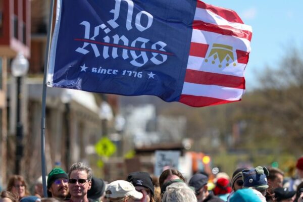 Business leaders discussing democracy's impact on the stock market
