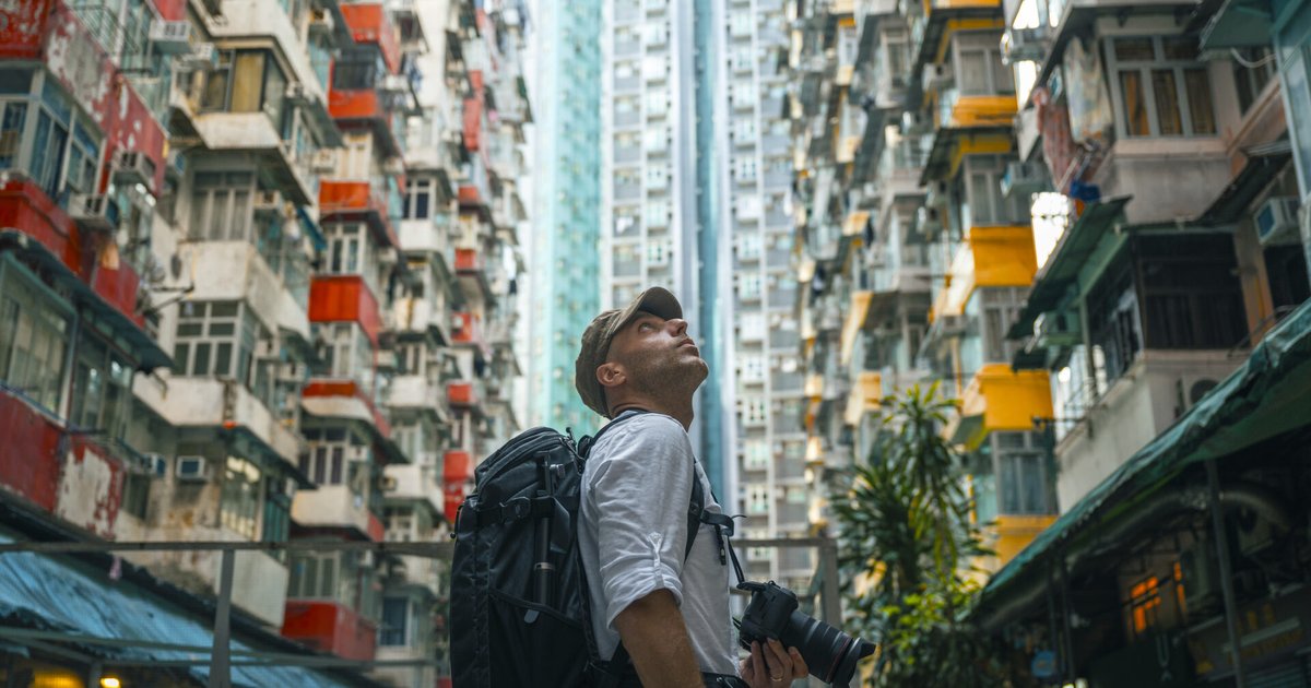 Citi Strata Elite credit card with travel-related items like luggage and a globe