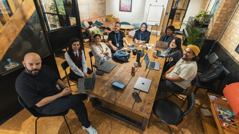 Claude AI team discussing innovative design strategies with Canva.