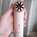 Dyson handheld fan showcased in a modern setting, highlighting its design and features.