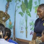 Facebook logo with a gavel symbolizing attorney advertising ban over addiction claims.