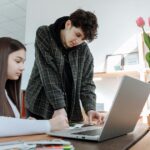 A diverse group of professionals engaged in a meaningful conversation about mental health at work.