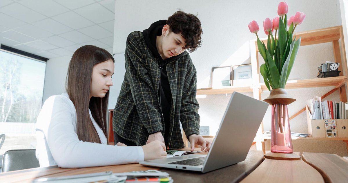 A diverse group of professionals engaged in a meaningful conversation about mental health at work.