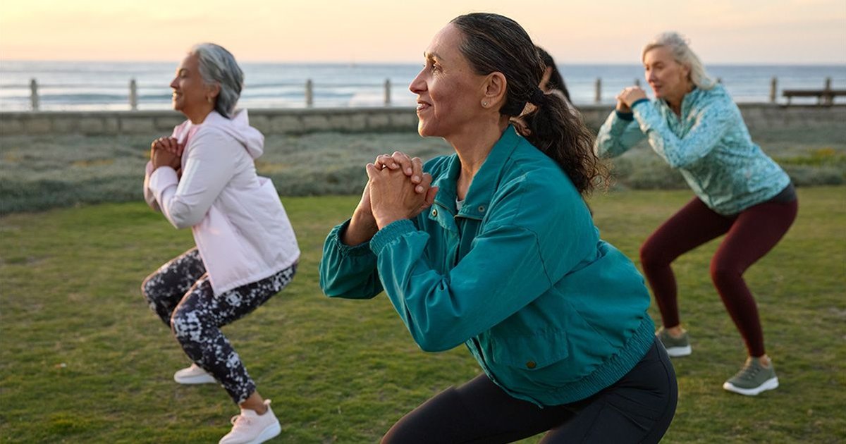 Mature women exercising outdoors, promoting fitness and health in midlife.