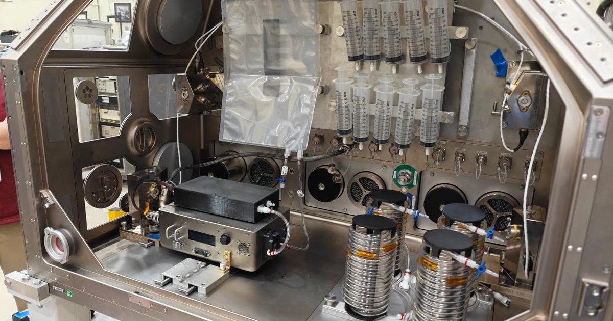 NASA astronaut preparing IV fluid for medical emergencies in space missions.