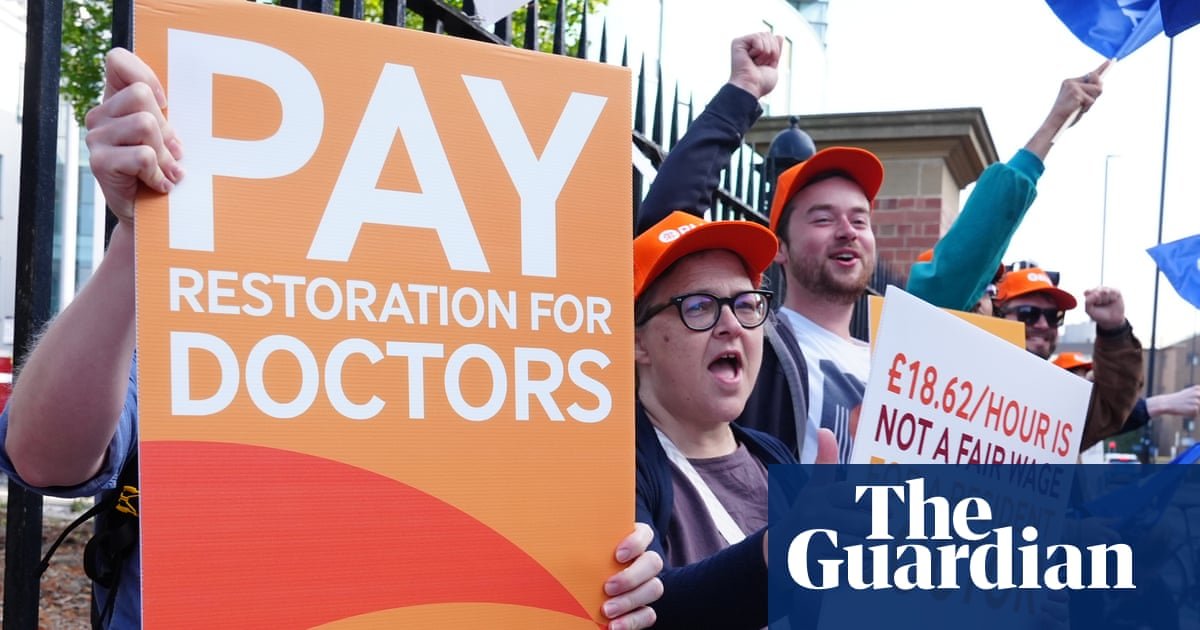 Doctors striking outside an NHS hospital, highlighting public health concerns.