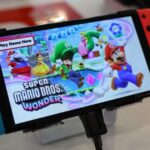 Nintendo logo with a gavel symbolizing tech regulation and consumer rights