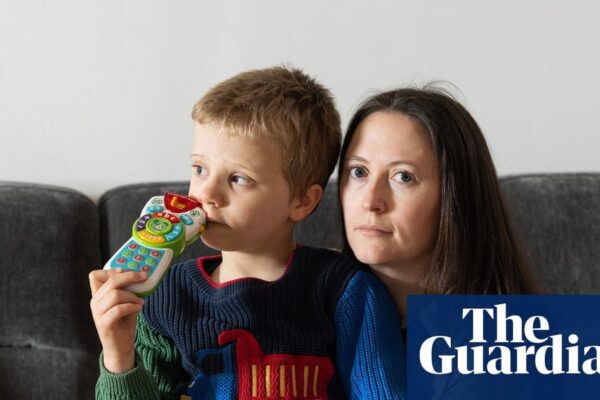 A concerned family discussing the impact of special needs education changes on their child's future.