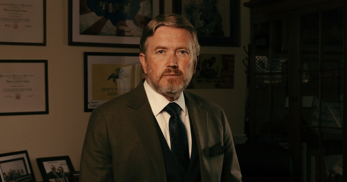 Thomas Massie speaking at a political event, challenging Trump