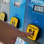 A tribal gas station sign showcasing fuel prices and convenience store offerings.