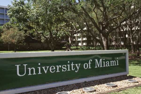 A marketing campaign in a subway station promoting charter schools and university enrollment.