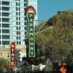 Paramount and Warner Bros. logos representing a media merger impacting personal finance