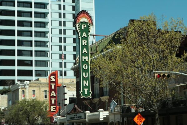 Paramount and Warner Bros. logos representing a media merger impacting personal finance