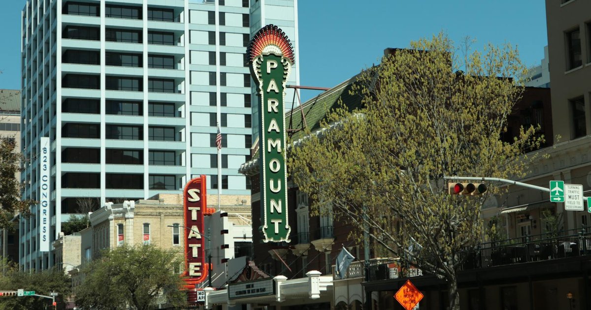 Paramount and Warner Bros. logos representing a media merger impacting personal finance